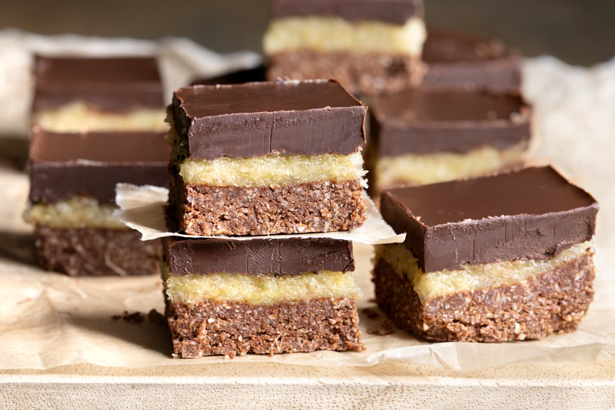 Easy slice with dark chocolate and crystallized ginger on a wooden board