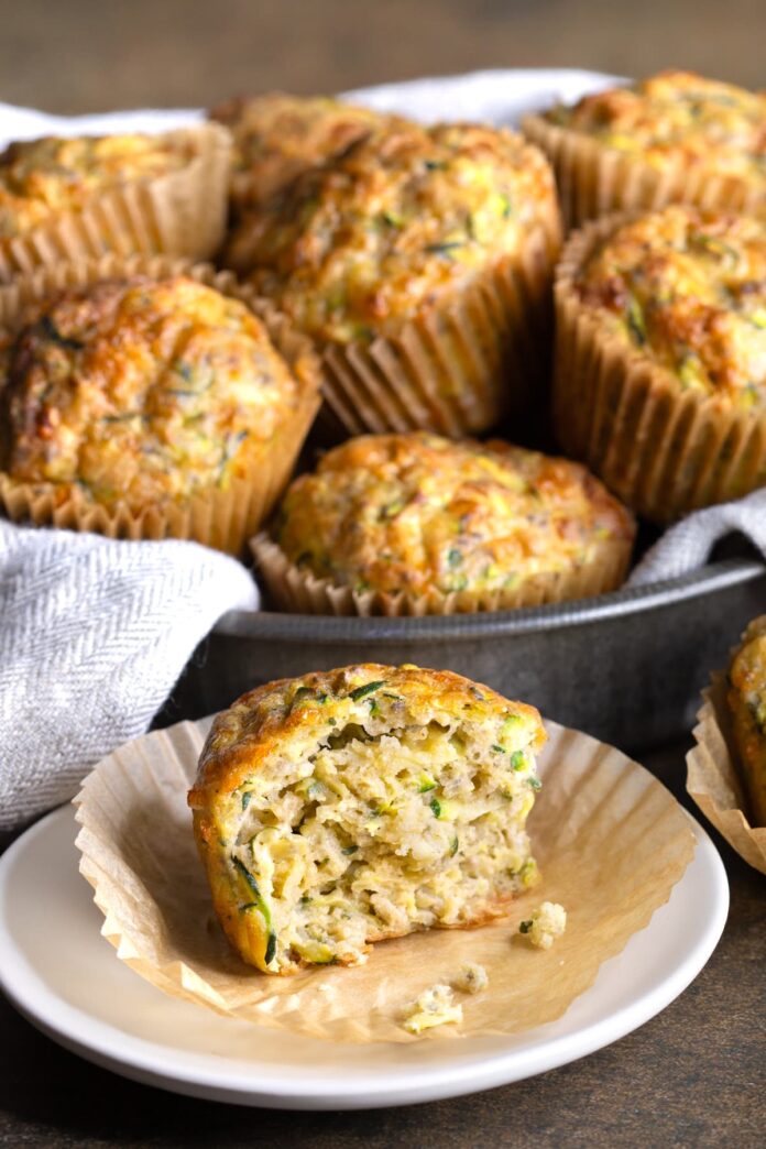 Buckwheat zucchini muffins with one muffin broken in half