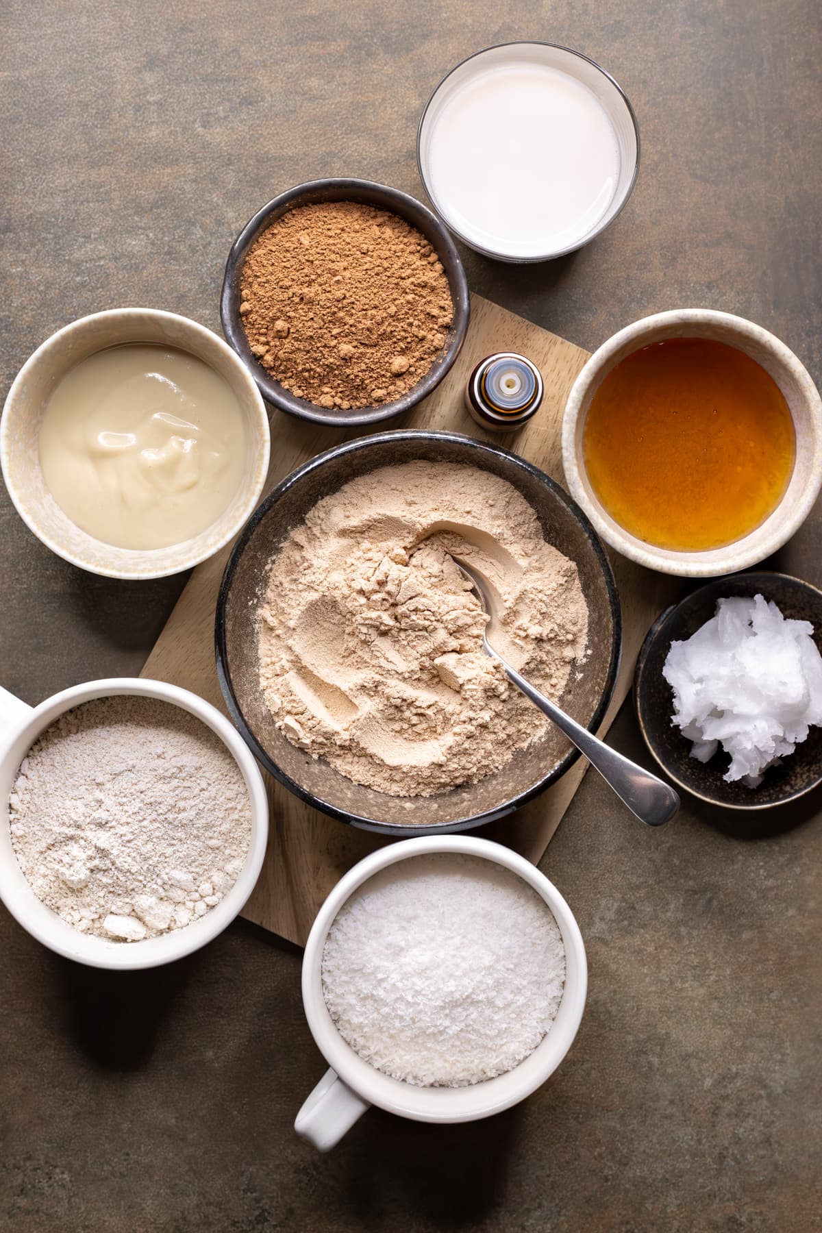 Ingredients to make chocolate mint protein balls divided into bowls