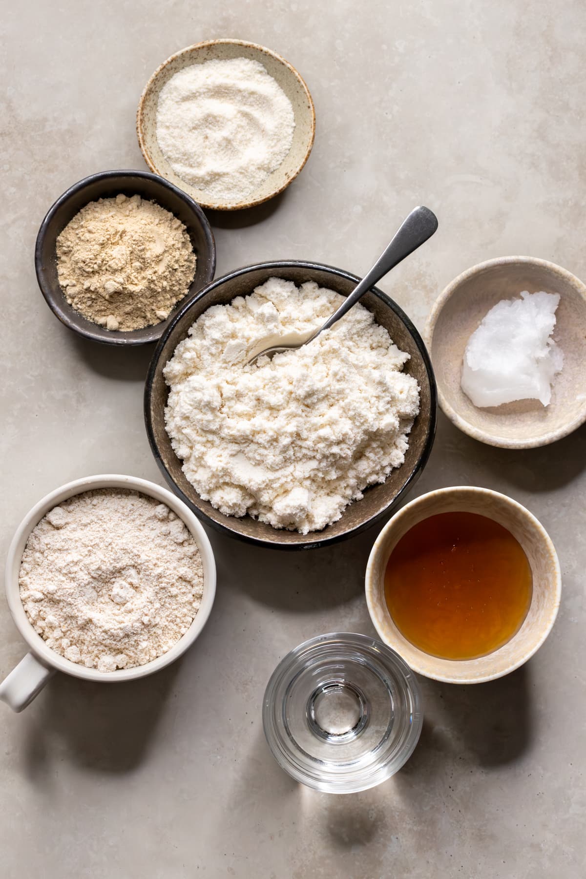 Ingredients for clean protein bars divided into bowls