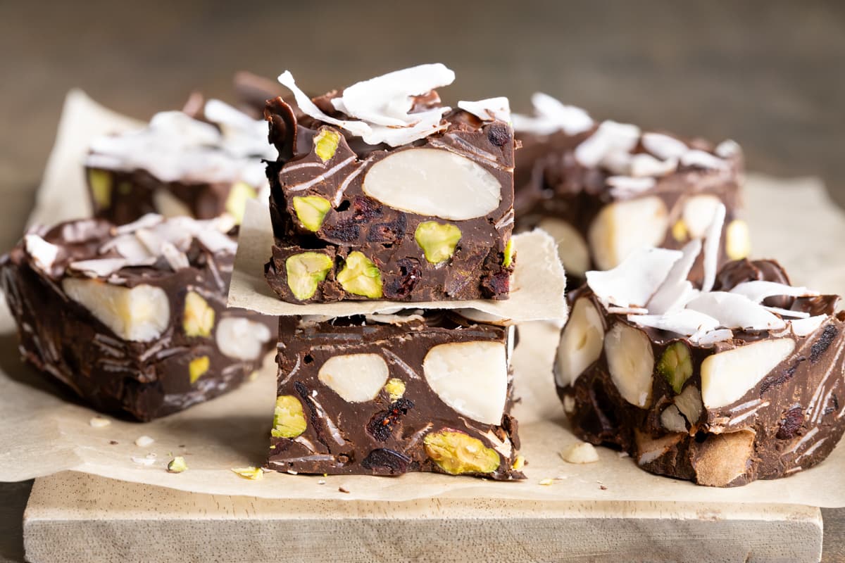 Pieces of easy raw rocky road arranged on a wooden board