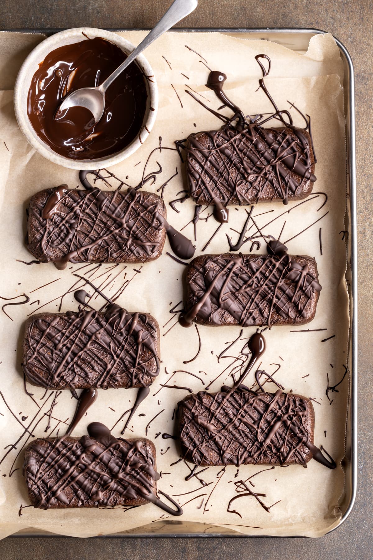 Chocolate protein bars made with whey protein powder and drizzled with chocolate