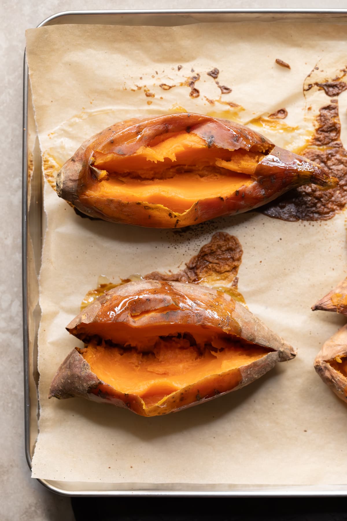 Baked sweet potato on a tray to use in savory muffins