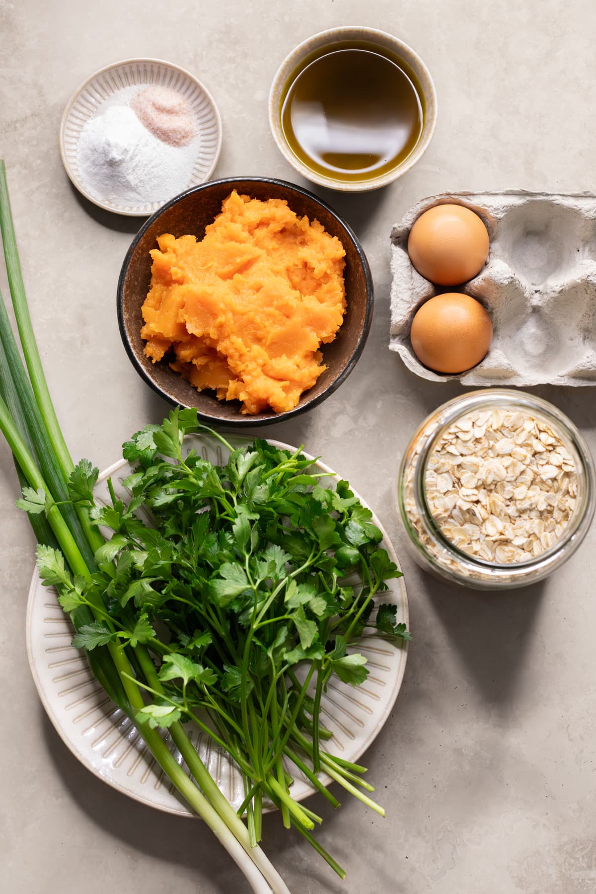 Ingredients for savory sweet potato muffins set out on a table