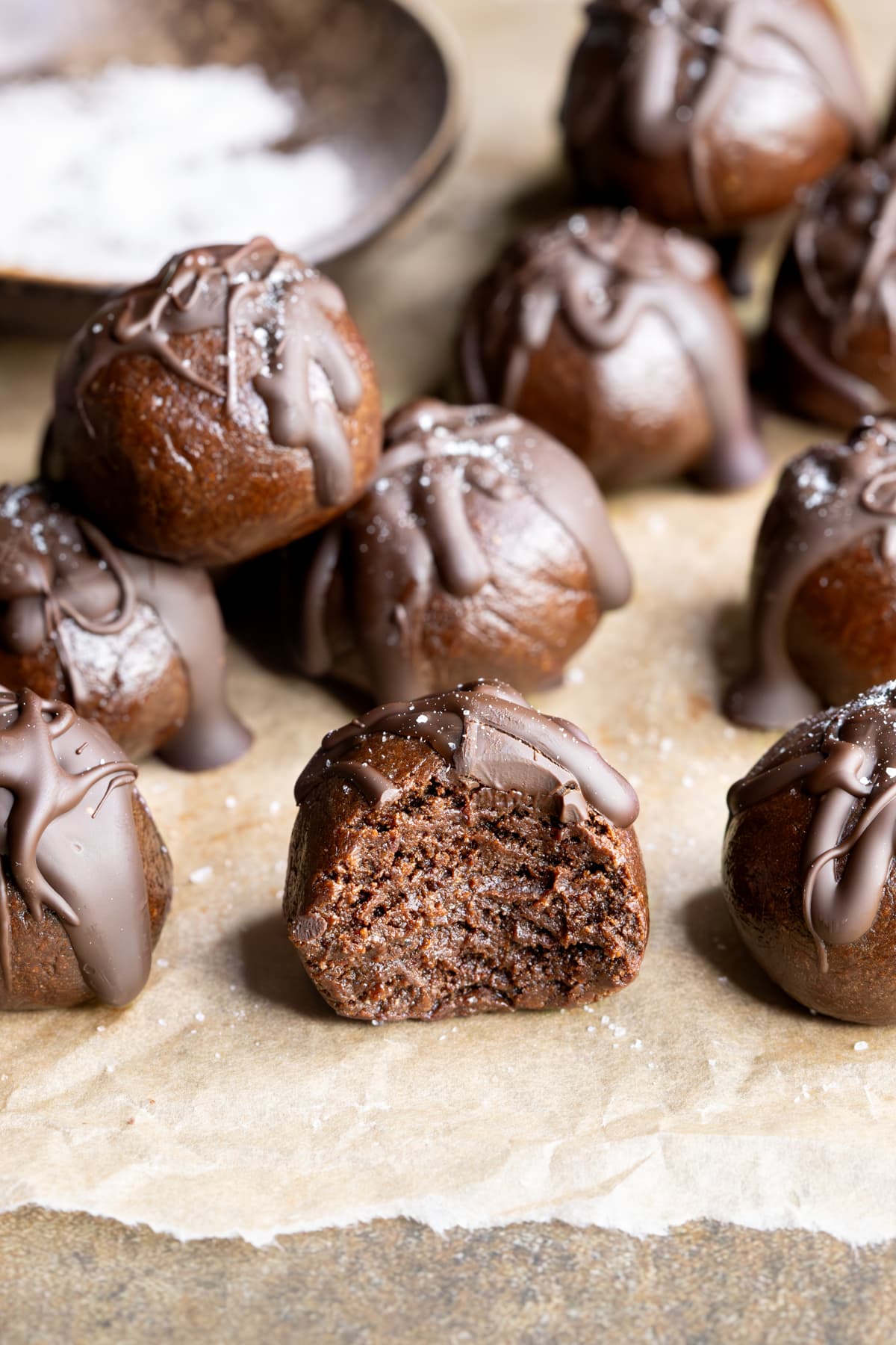 Chewy choc mint whey protein balls with a bite taken out of one ball