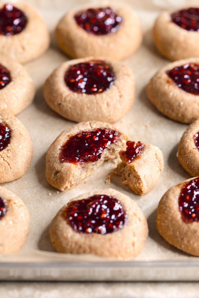 Buckwheat jam thumbprint cookies on a baking tray