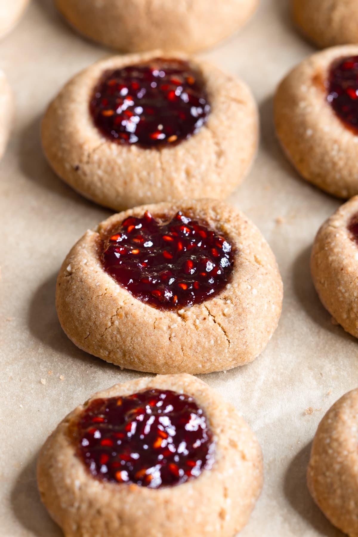 Healthy buckwheat jam thumbprint cookies on a baking tray