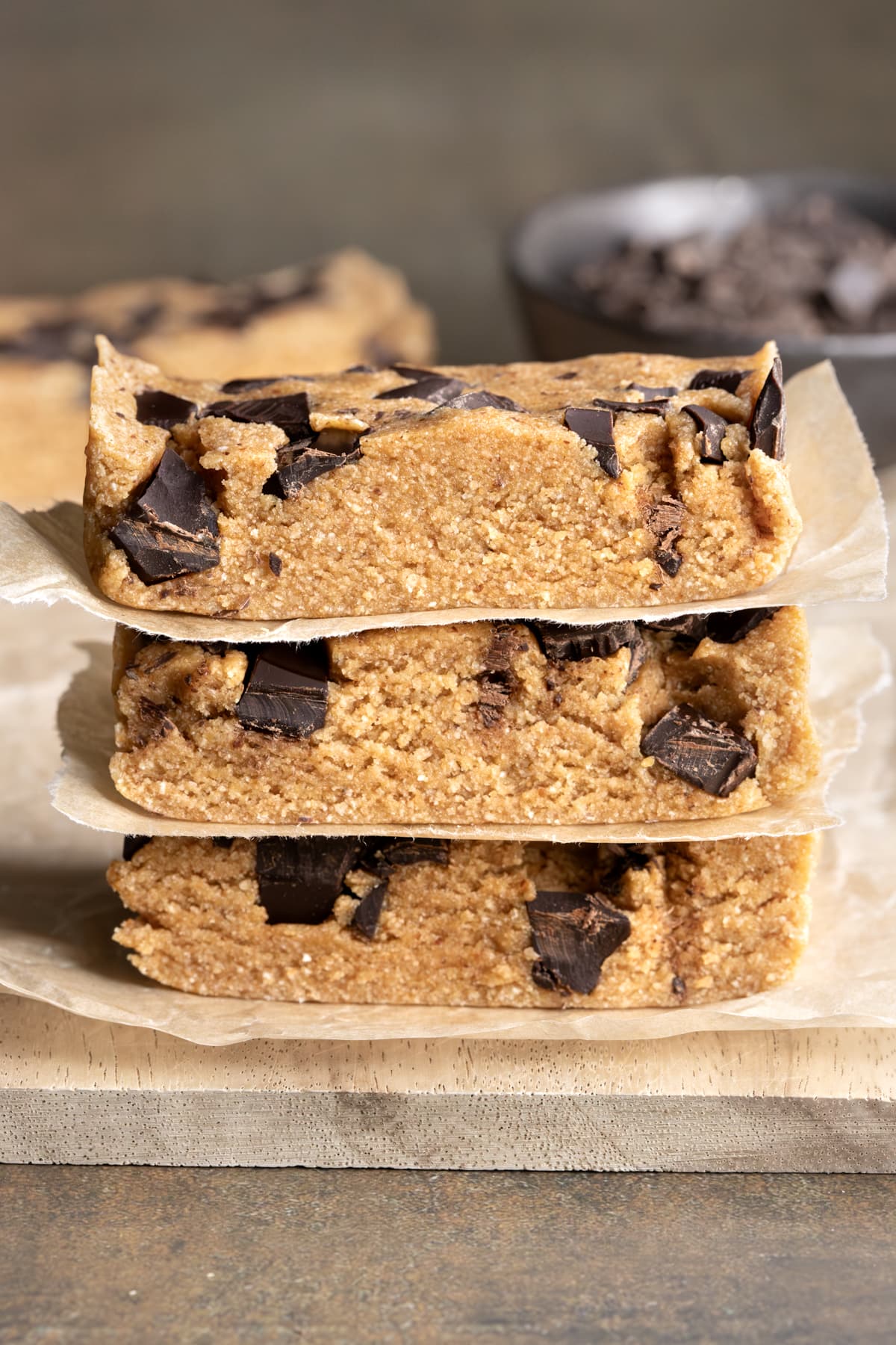 Gluten-free oat bars with chocolate stacked on top of each other