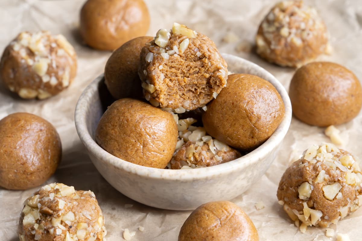 Coffee-flavored protein balls with a bite taken out of one ball