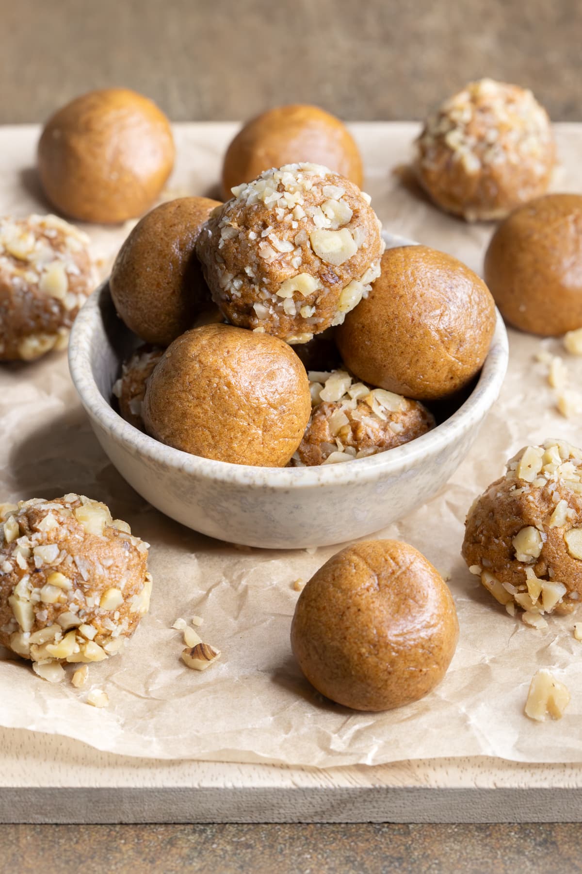 Chewy coffee whey protein balls in a small bowl