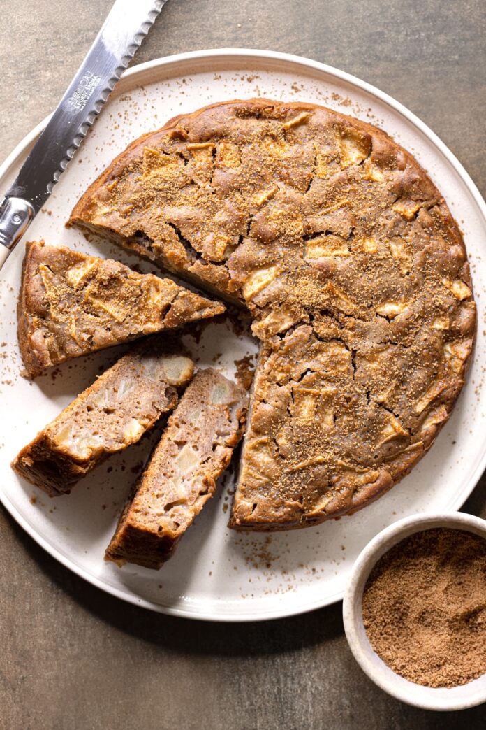 Gluten-free apple cake made without eggs on a white serving plate