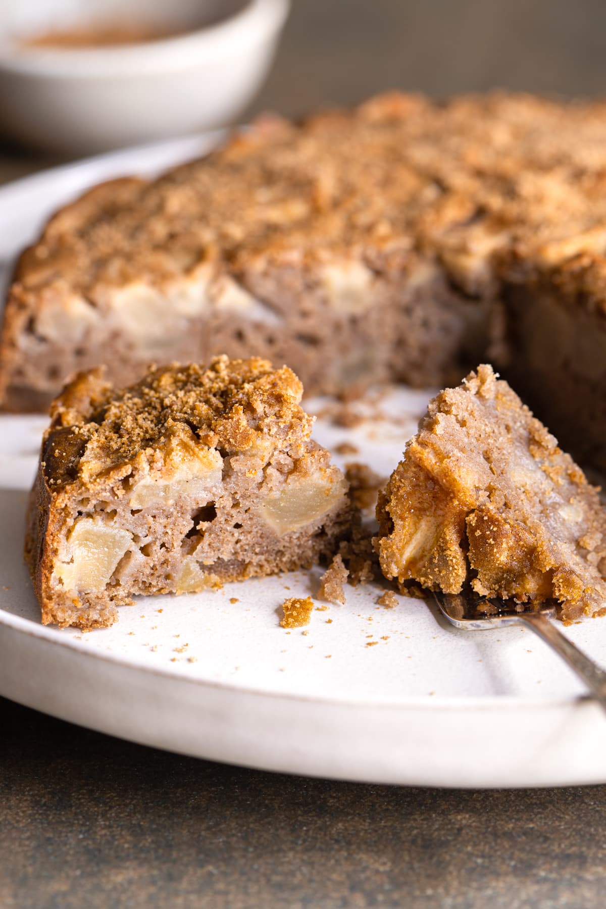 Easy gluten-free apple cake slice served with coconut sugar