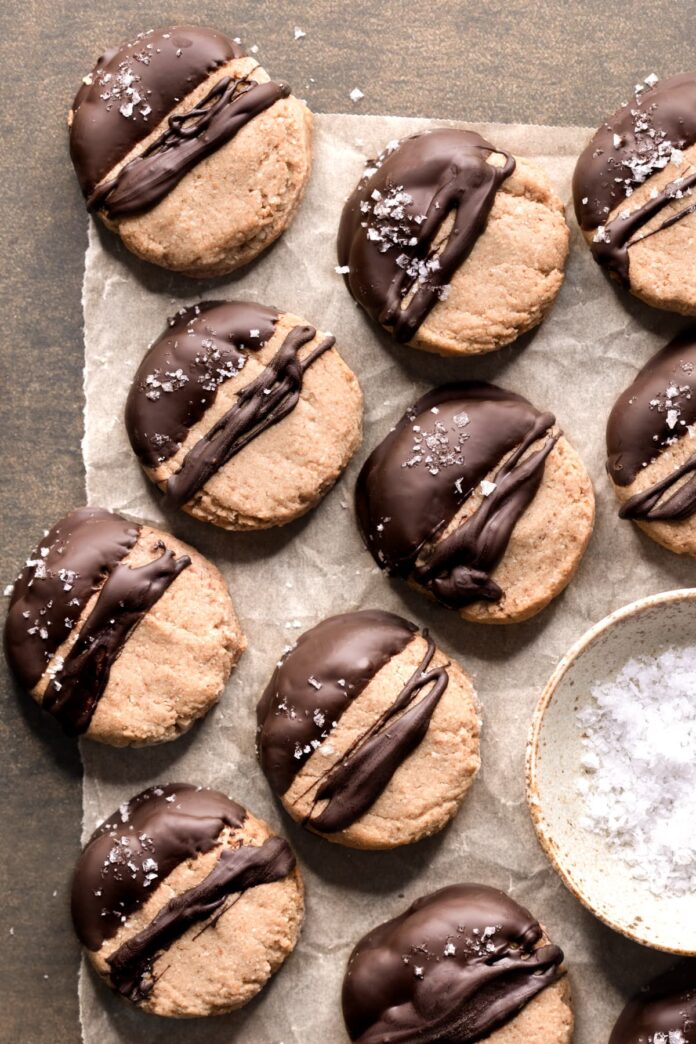 Easy almond olive oil shortbread cookies dipped in chocolate and sprinkled with sea salt