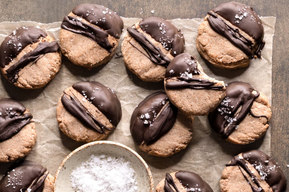 Chocolate-dipped almond olive oil shortbread cookies with sea salt flakes