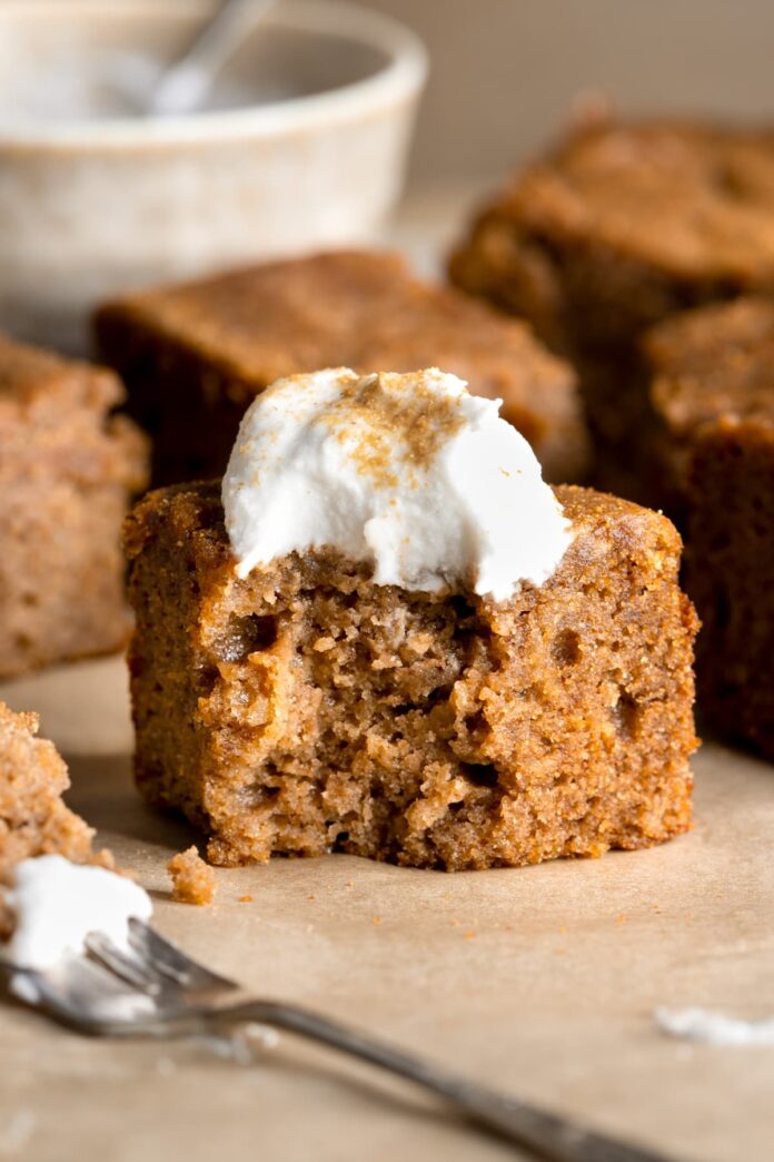 Gluten-free gingerbread cake served with whipped coconut cream