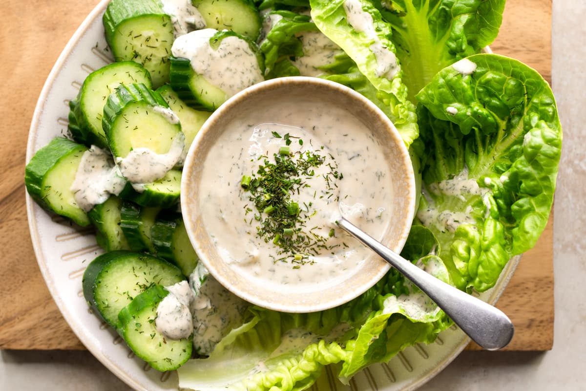 Tahini ranch dressing served with fresh green vegetables