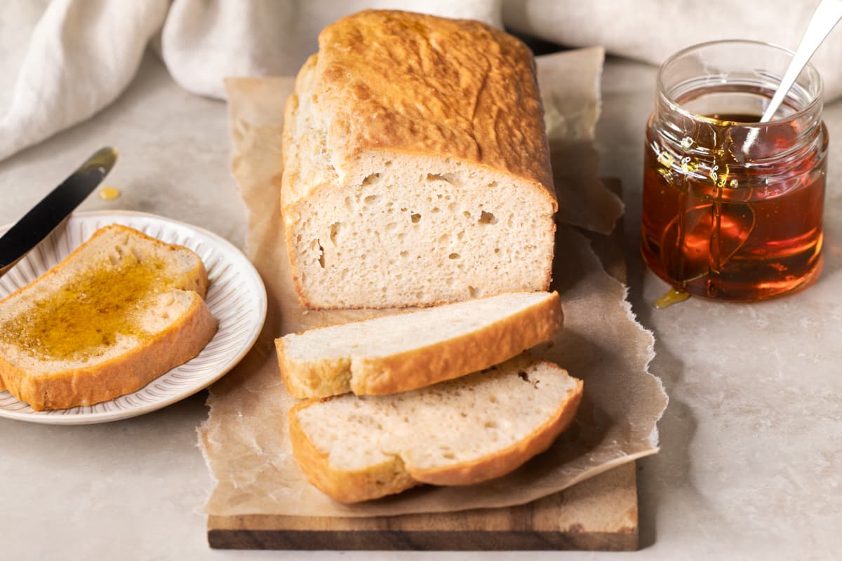 A loaf of bread with two slices cut