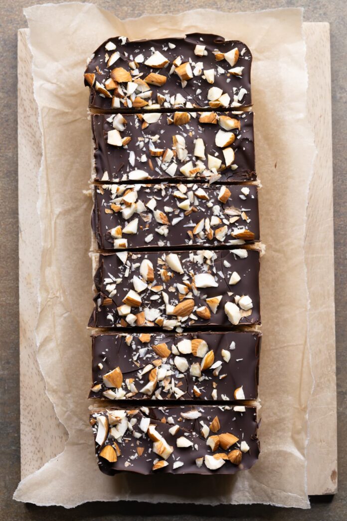 No-bake almond nougat protein bars topped with dark chocolate