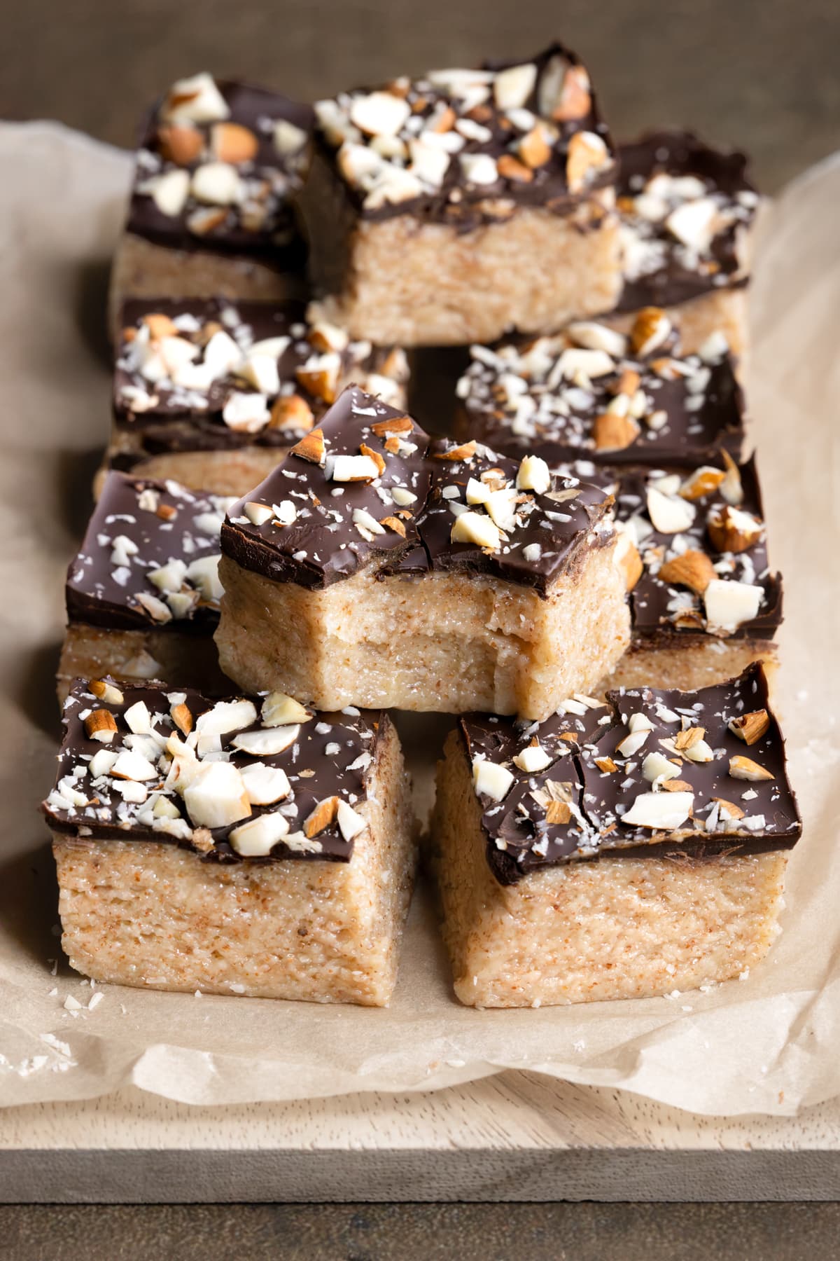 Almond nougat protein bars with a bite taken out of one bar