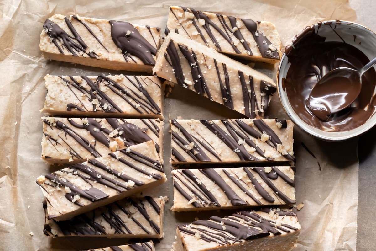 Peanut butter oat protein bars with melted chocolate drizzled on top