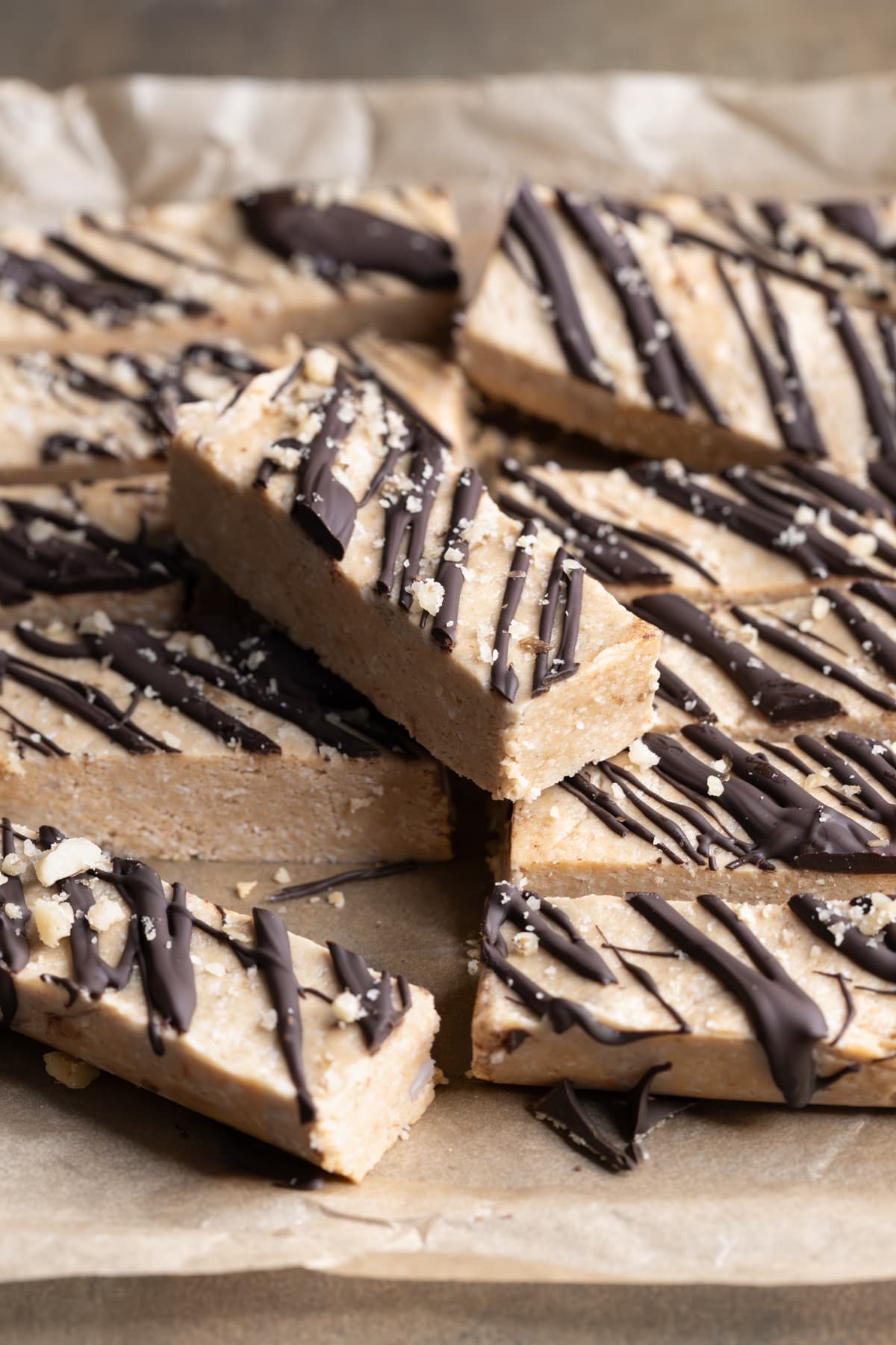 Protein bars with chocolate topping stacked on top of each other