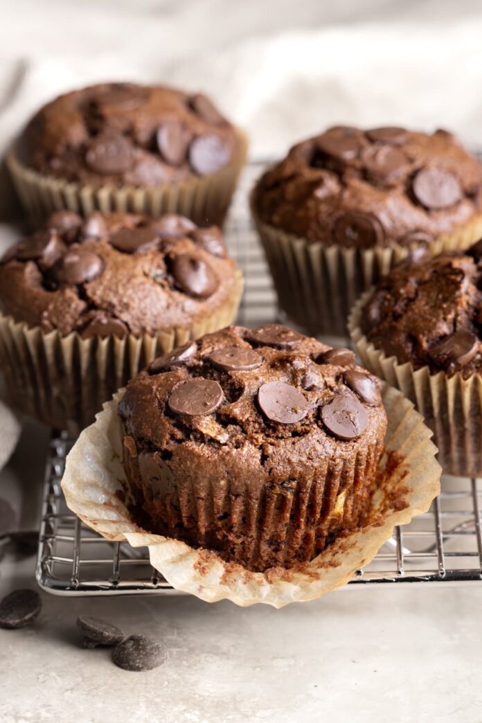 A small batch of chocolate zucchini muffins on a wire cooking rack