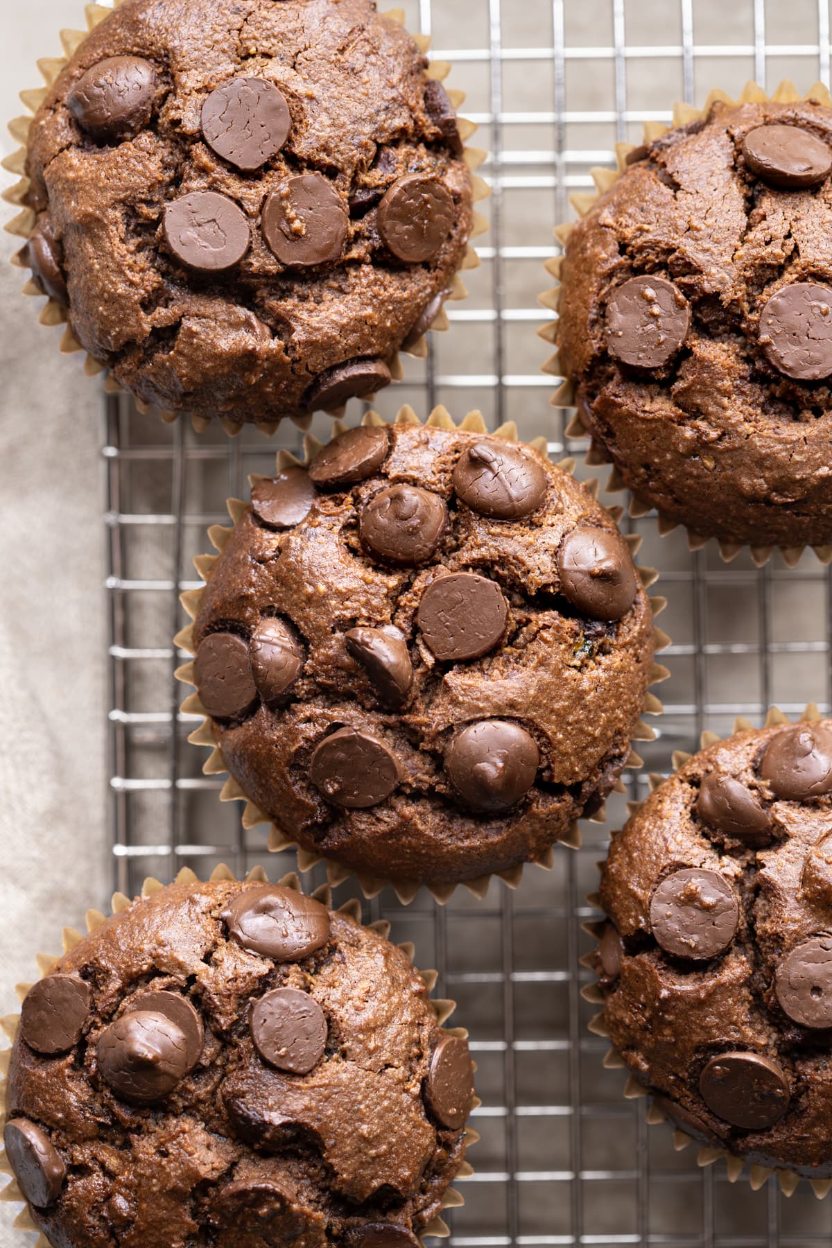 Small batch zucchini muffins with chocolate chips on a cooling rack