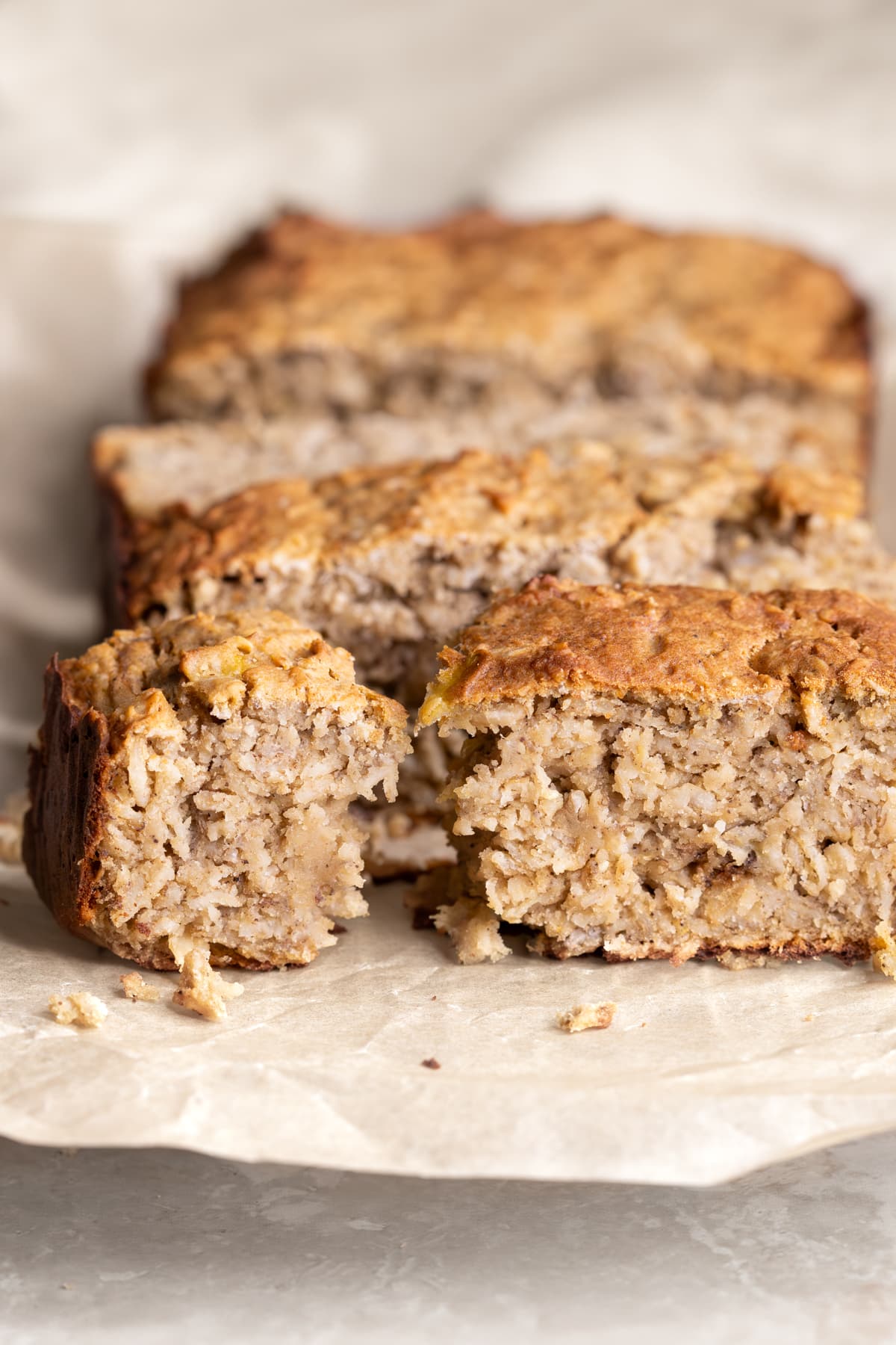 Banana baked oatmeal protein bars with one bar broken in half