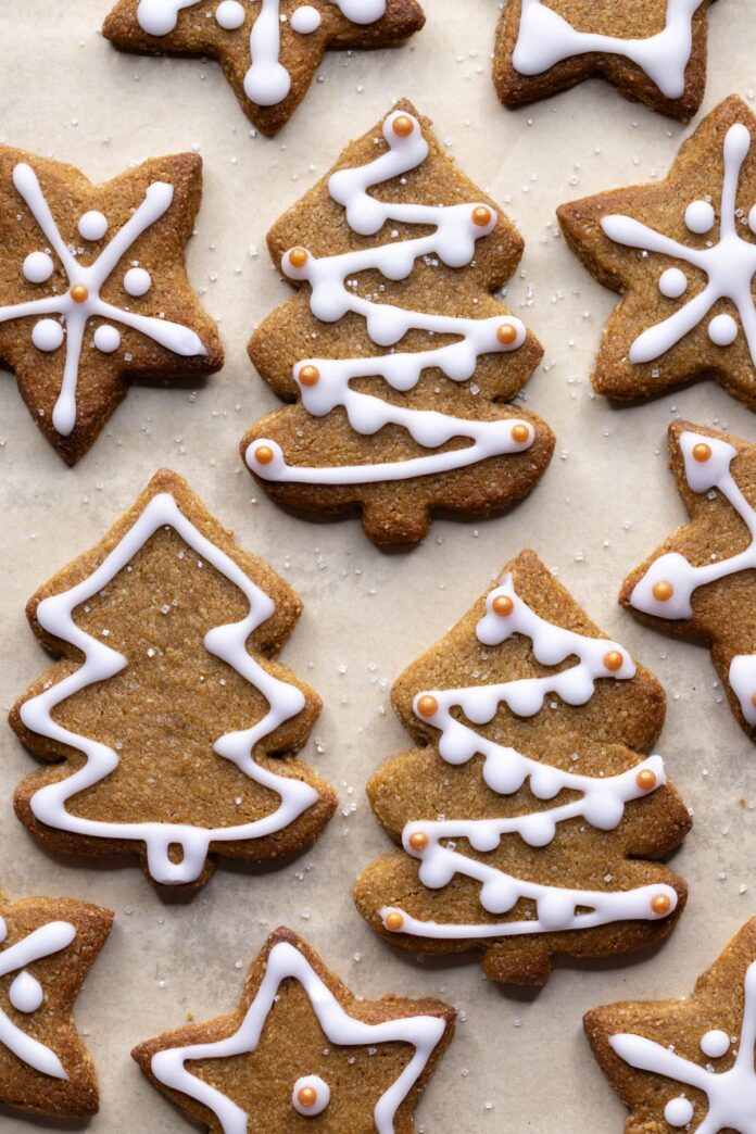 Gingerbread Christmas tree and star cookies decorated with glace icing