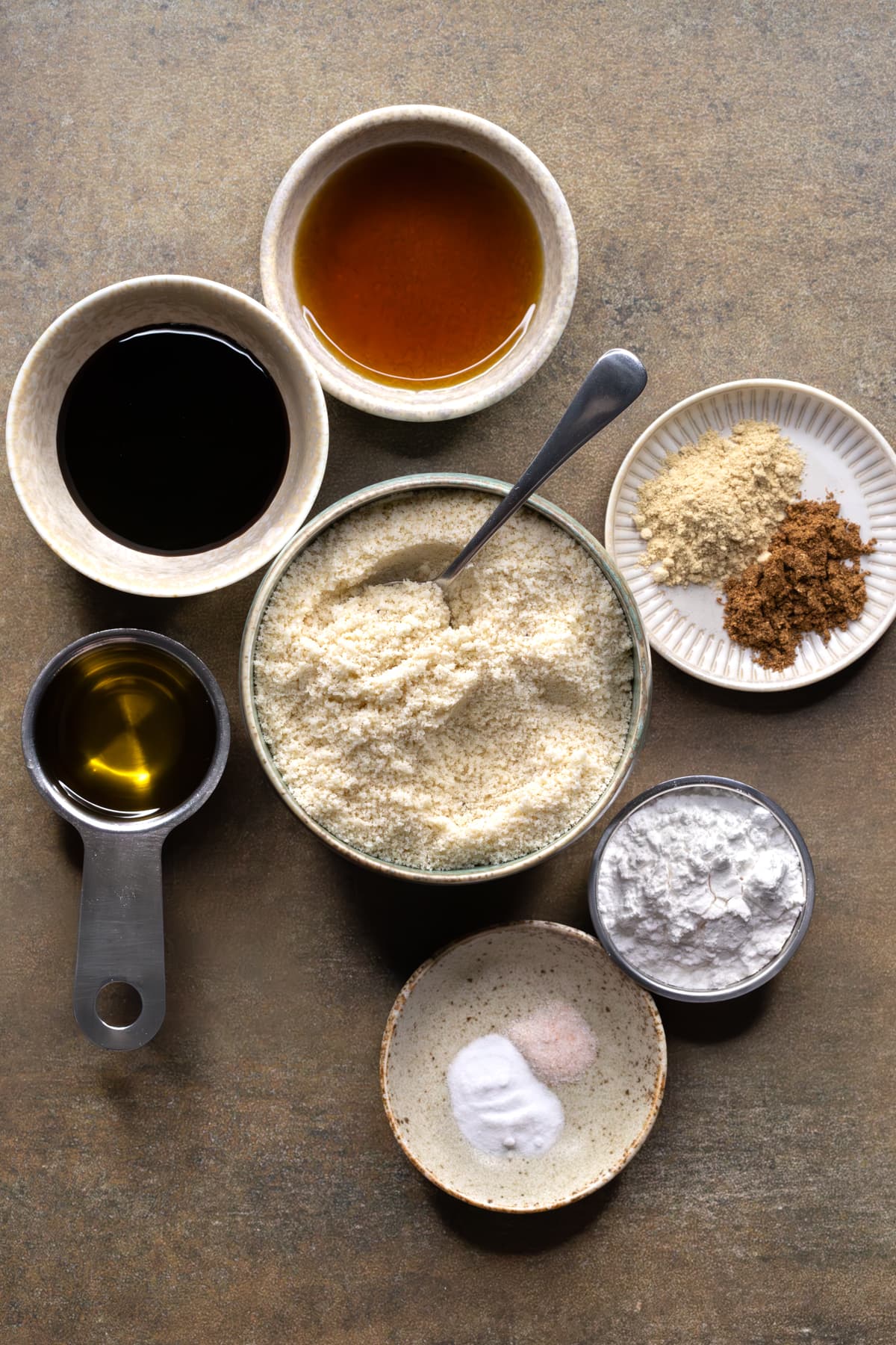 Ingredients for gluten-free gingerbread cookies set out in bowls