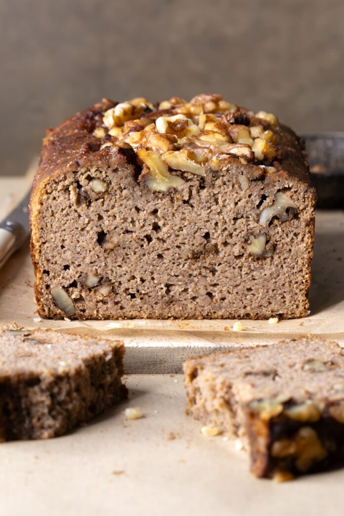 A loaf of coconut flour banana bread with walnuts