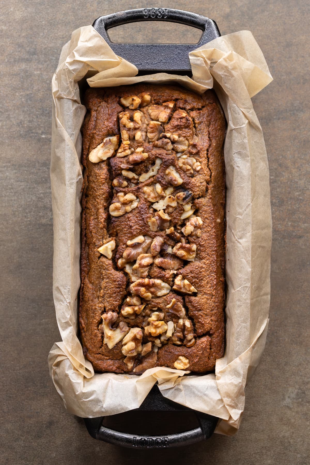 Banana bread with walnuts in a cast iron loaf pan