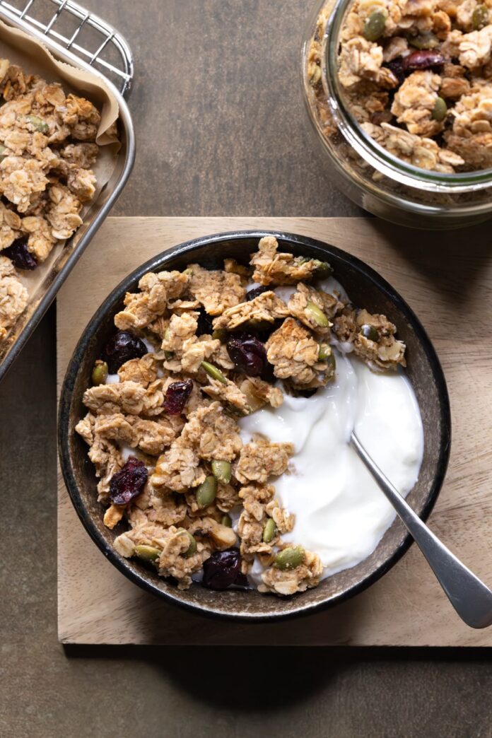 Granola clusters served in a bowl with yogurt