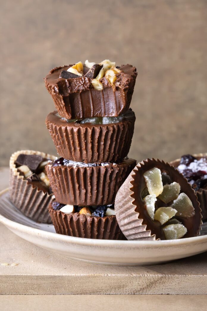 Vegan chocolate fudge bites stacked on top of each other