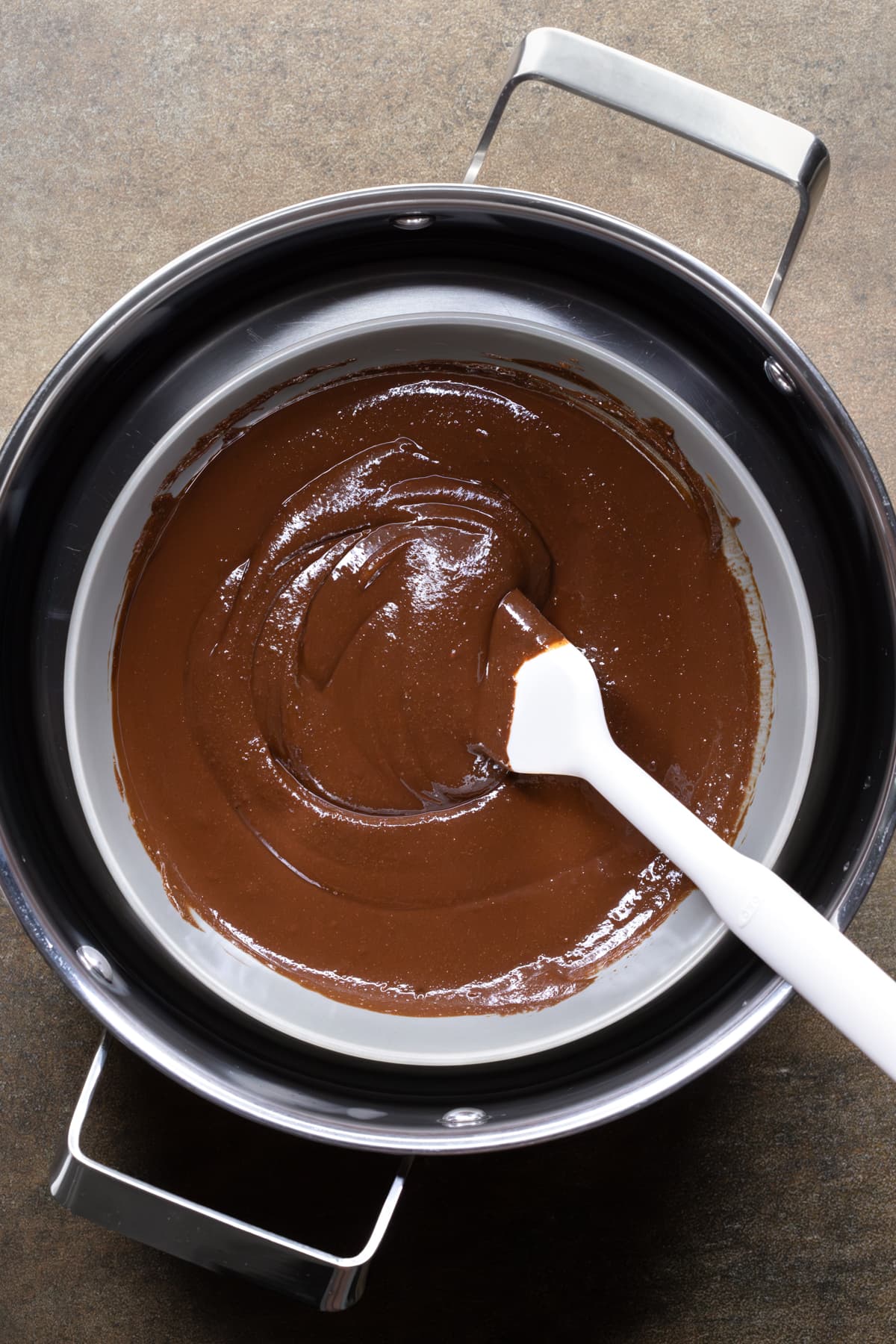 Chocolate fudge mixture melted in a hot water bath