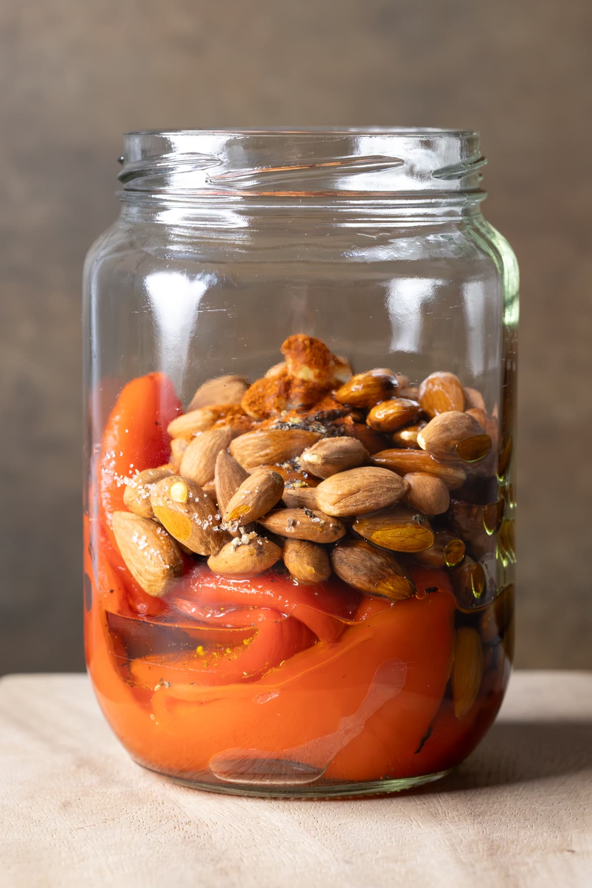 Roasted red peppers and almonds in a jar